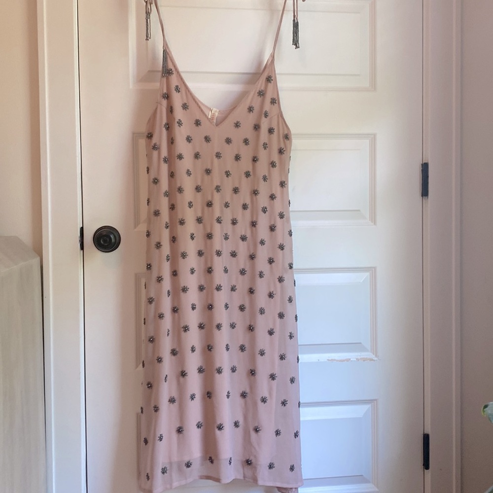 Beautifully beaded shift dress with tie straps.